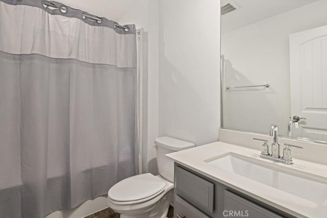 full bathroom featuring vanity, toilet, and shower / bathtub combination with curtain