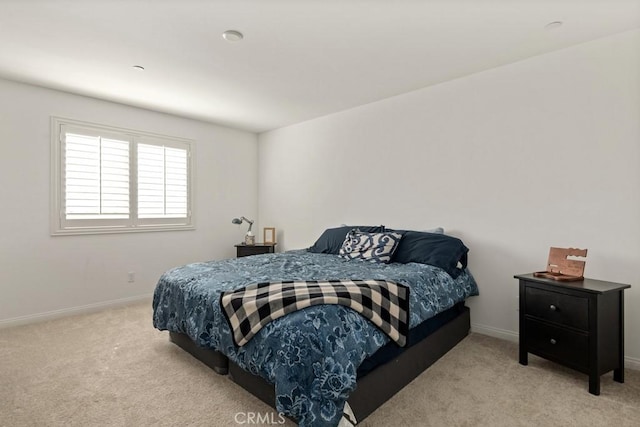 bedroom featuring light colored carpet