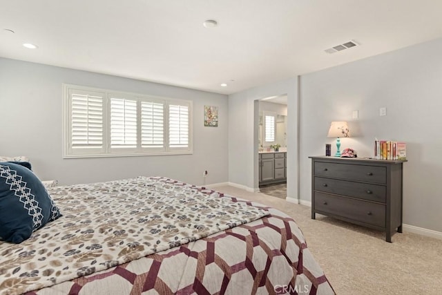 carpeted bedroom featuring connected bathroom