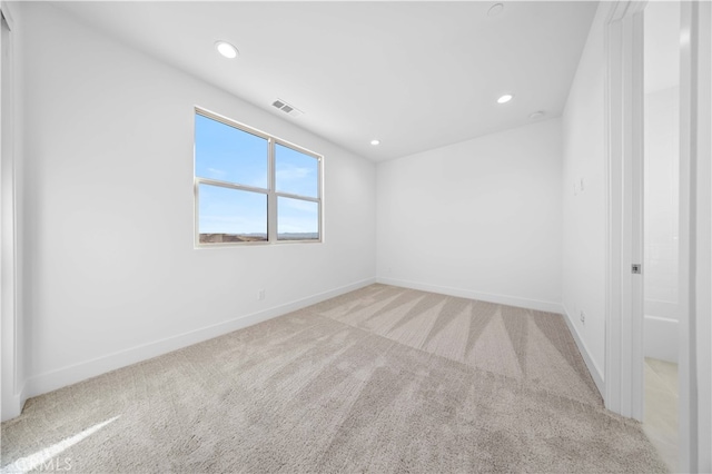 view of carpeted spare room