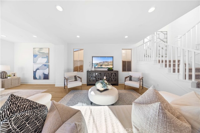 living room with light hardwood / wood-style flooring