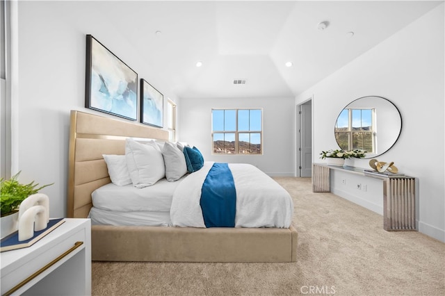 carpeted bedroom featuring lofted ceiling