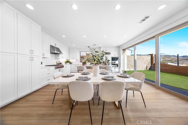 dining room with light wood-type flooring