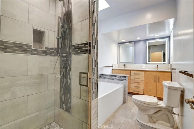 full bathroom featuring shower with separate bathtub, vanity, toilet, and tile patterned floors