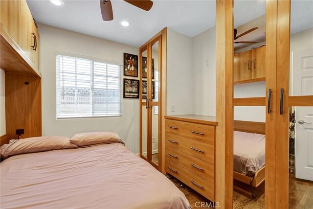 bedroom featuring hardwood / wood-style floors and ceiling fan