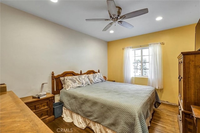 bedroom featuring ceiling fan and wood-type flooring