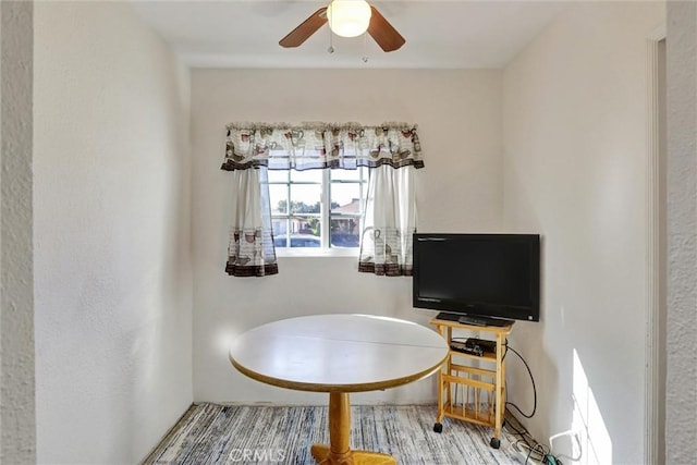 dining space featuring ceiling fan