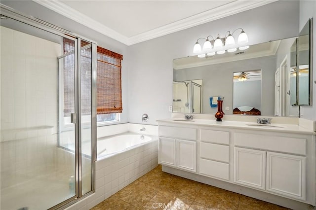 bathroom with plus walk in shower, vanity, ceiling fan, and crown molding