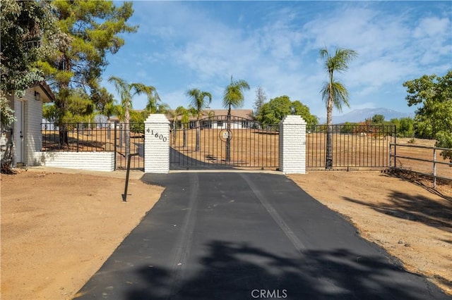 view of gate with a mountain view