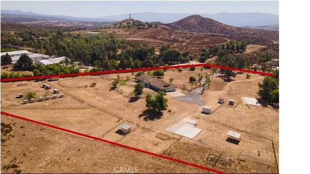 birds eye view of property featuring a mountain view