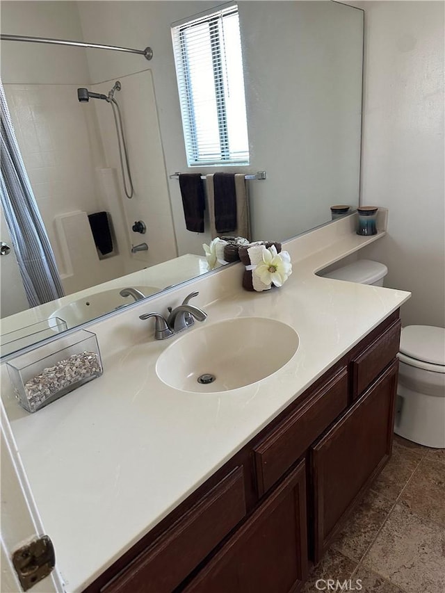 full bathroom with vanity, toilet, and shower / bath combo with shower curtain