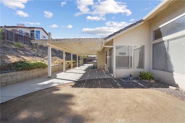 exterior space featuring a carport