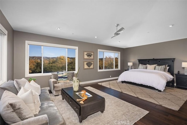 bedroom featuring hardwood / wood-style floors and multiple windows