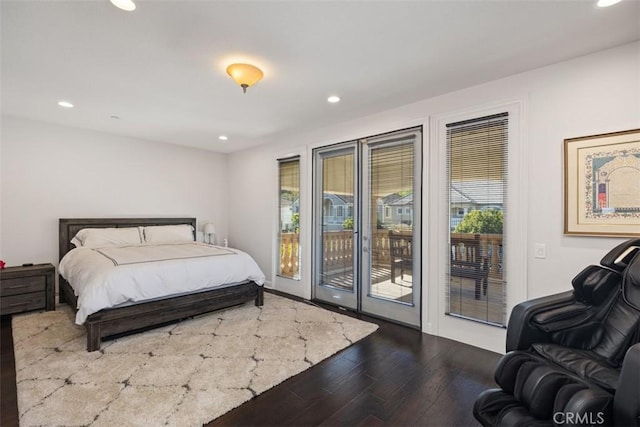 bedroom featuring access to outside and hardwood / wood-style flooring