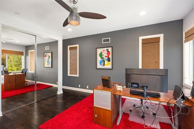 office area featuring ceiling fan and dark hardwood / wood-style flooring