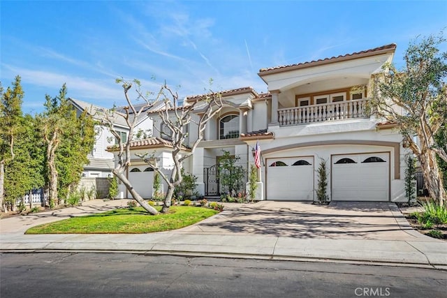 view of front of property with a balcony and a garage