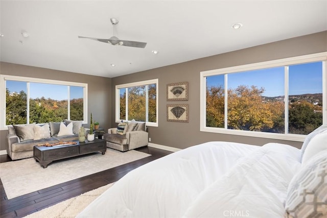 bedroom with ceiling fan and dark wood-type flooring