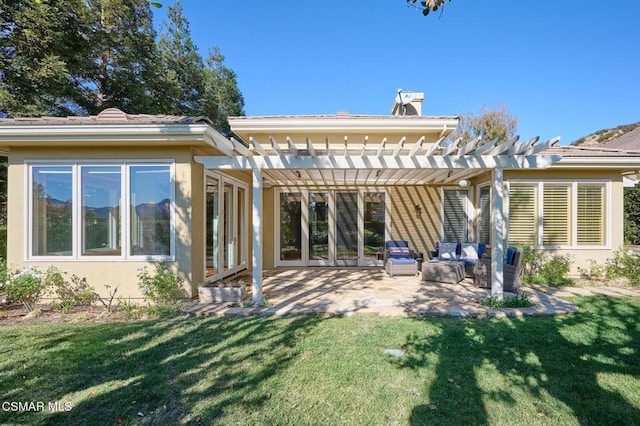 rear view of property with a lawn, a patio area, and a pergola