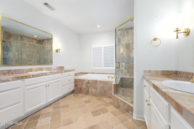 bathroom with tile patterned flooring, vanity, and independent shower and bath