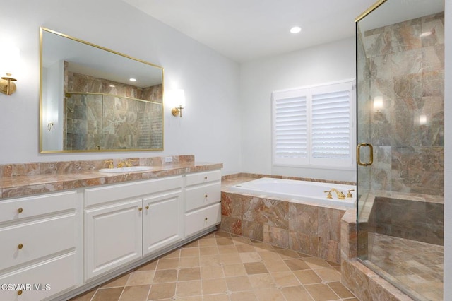 bathroom with tile patterned floors, vanity, and independent shower and bath