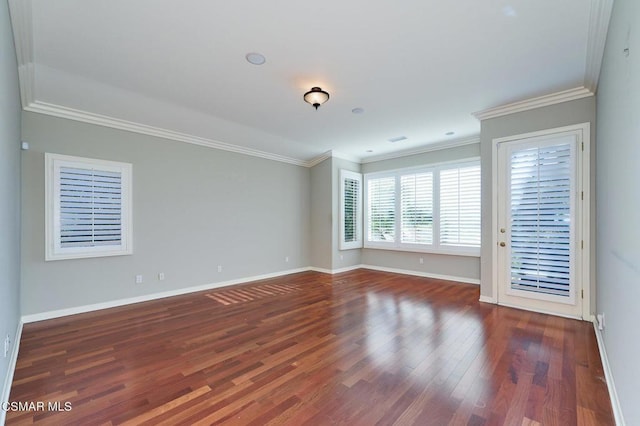 unfurnished room featuring dark hardwood / wood-style flooring and crown molding