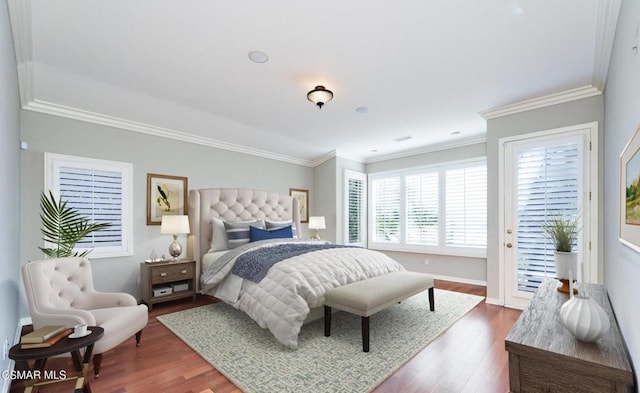 bedroom with access to exterior, ornamental molding, and hardwood / wood-style flooring