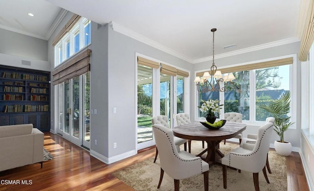 dining area featuring hardwood / wood-style flooring and a healthy amount of sunlight