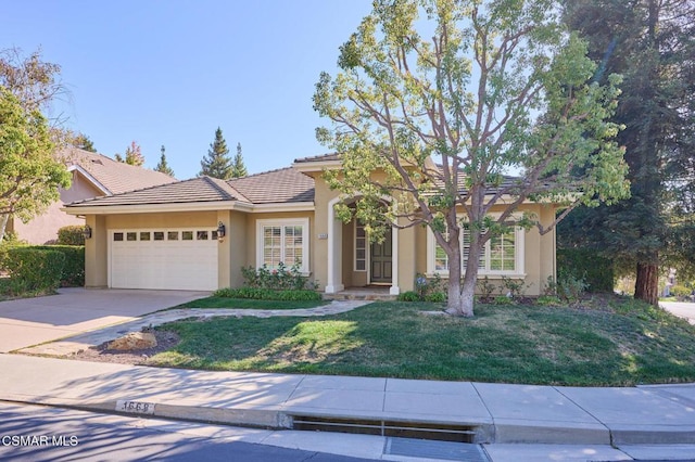 view of front facade featuring a garage and a front yard