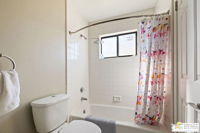 bathroom with shower / bath combination with curtain and toilet