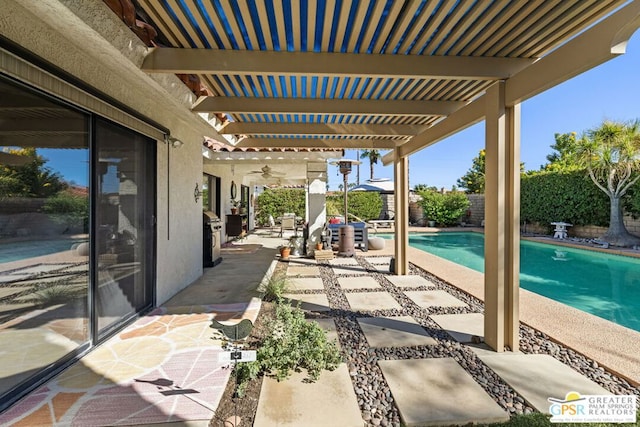 view of patio / terrace featuring a pergola, a fenced in pool, and ceiling fan