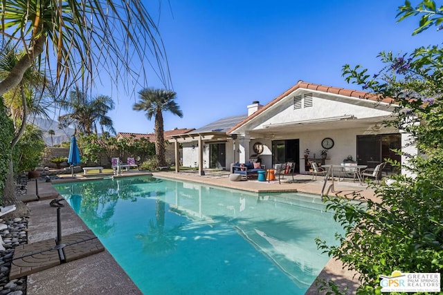 view of pool featuring a patio area