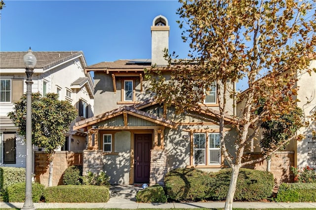 view of front of property with solar panels