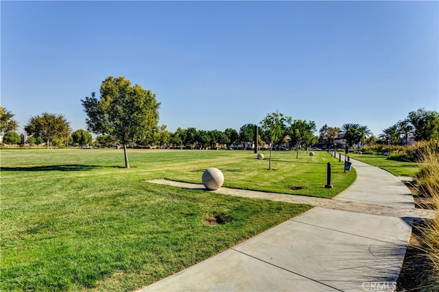 view of property's community with a lawn