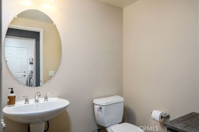 bathroom with toilet and sink