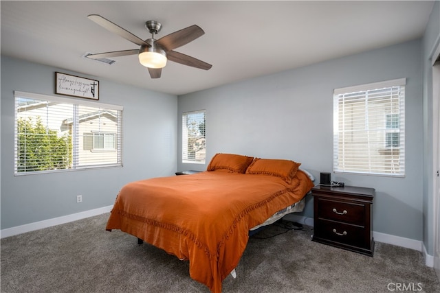 bedroom with dark colored carpet and ceiling fan