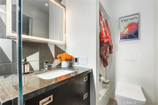 bathroom with vanity and toilet