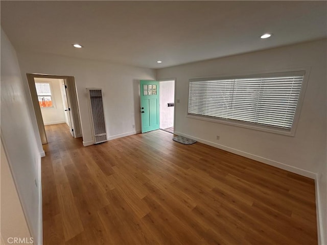 unfurnished room featuring hardwood / wood-style floors