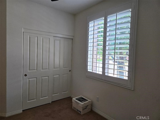 carpeted bedroom with a closet