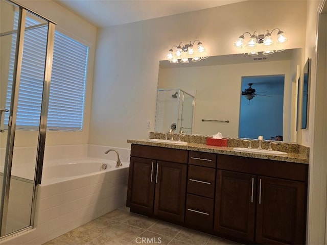 bathroom featuring tile patterned flooring, vanity, separate shower and tub, and ceiling fan