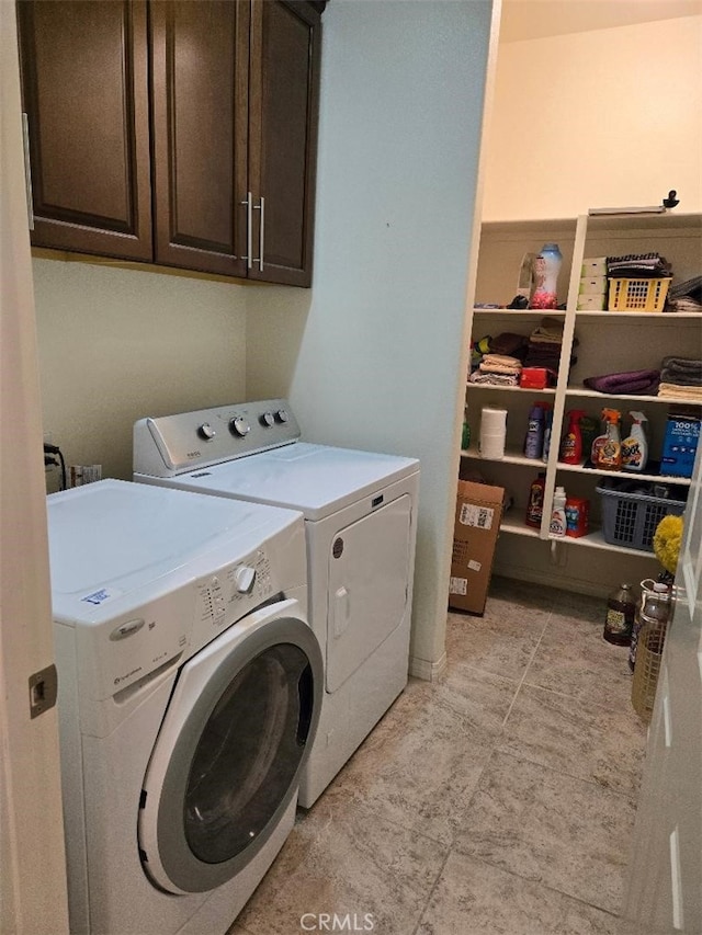 laundry room featuring cabinets and independent washer and dryer