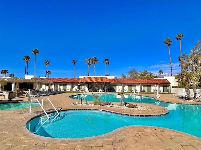 view of swimming pool with a patio