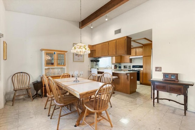 dining area featuring beamed ceiling, high vaulted ceiling, and a notable chandelier