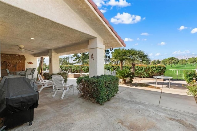 view of patio / terrace featuring ceiling fan and a grill