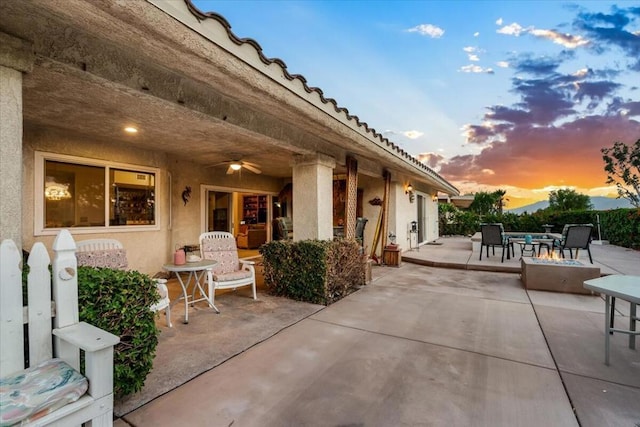 view of patio terrace at dusk