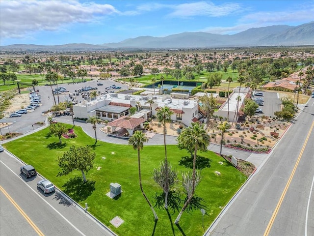 birds eye view of property with a mountain view