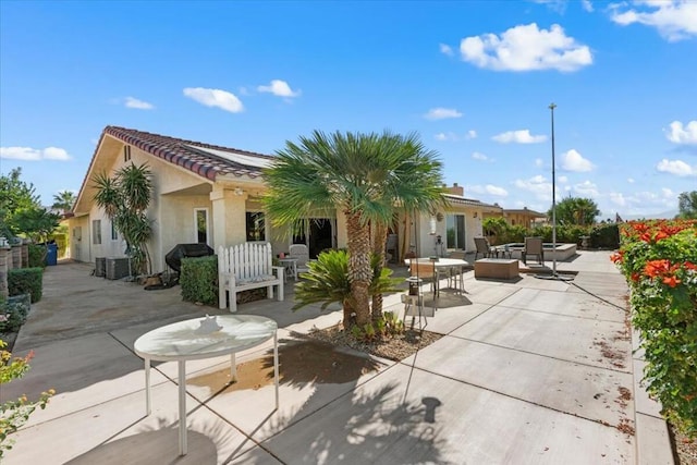 rear view of property with a patio