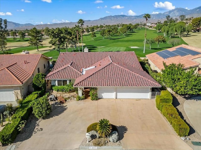 birds eye view of property with a mountain view