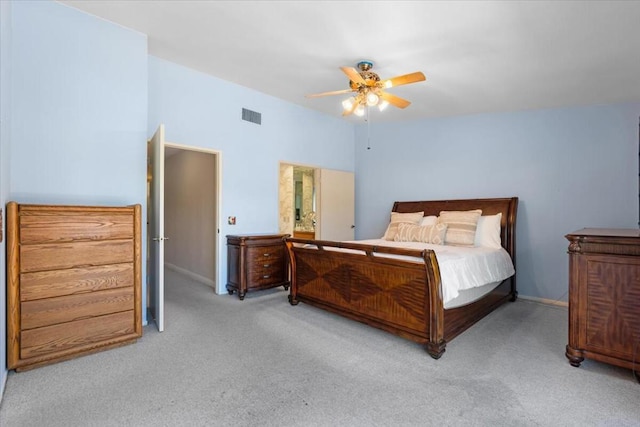 bedroom with ceiling fan and light carpet