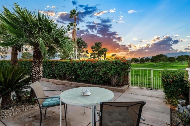 view of patio terrace at dusk