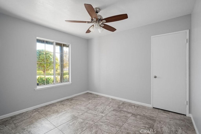 empty room featuring ceiling fan